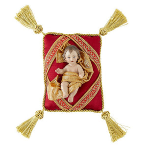 Small Christ Child on Red Pillow